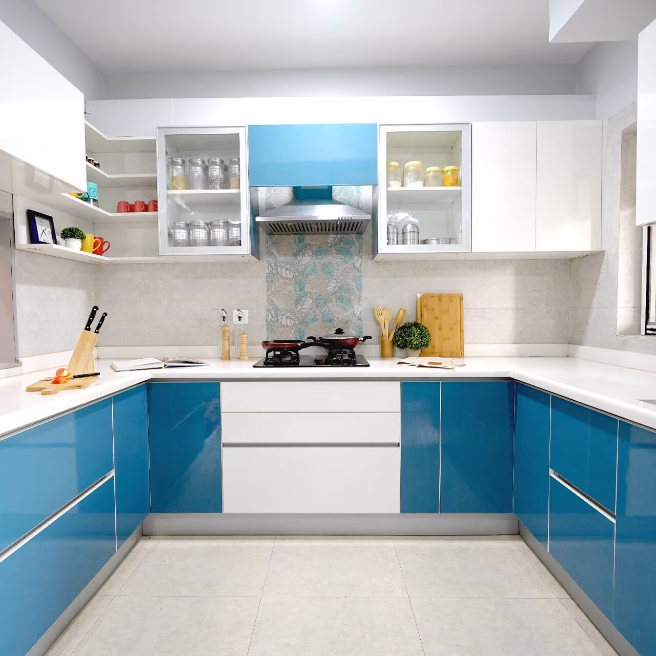 Modern modular kitchen with white cabinets and granite countertops